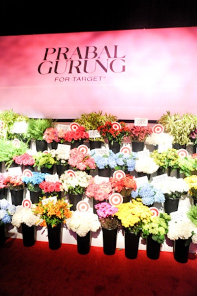 On the fantasy city street where the carnival took place, a flower-shop-style setup played double duty as the step-and-repeat. Inspired by a scene in the Prabal Gurung for Target TV commercial, the buckets of fresh flowers stood on tiered platforms, creating a wall of florals with small signs carrying the Target and Prabal Gurung logos rising from within.