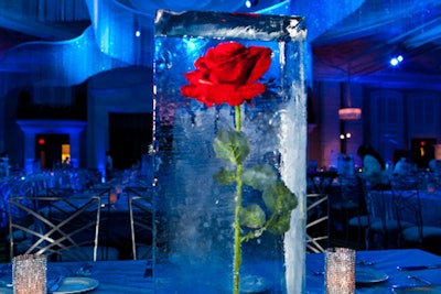 Fourth Wall Events designed each of the 67 centerpieces. A custom slide unit helped load each heavy block of ice into the center of the table.