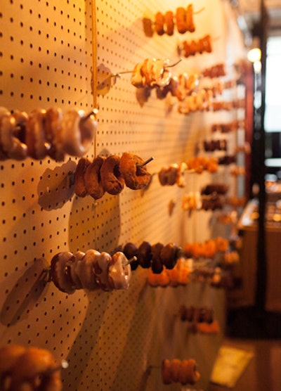 After the dinner reception, guests headed downstairs for desserts and a concert from Fitz and the Tantrums. Near the stage, a pegboard held chocolate, cinnamon-sugar, glazed yeast, and old-fashioned cake donuts.