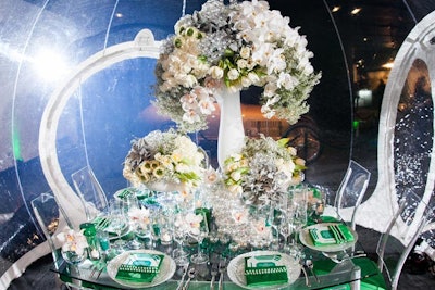 Event producer Alexandra Rembac-Goldberg of Sterling Engagements designed a showcase table with a bubble theme. The entire look was placed inside a clear bubble structure from Casa Bubble.
