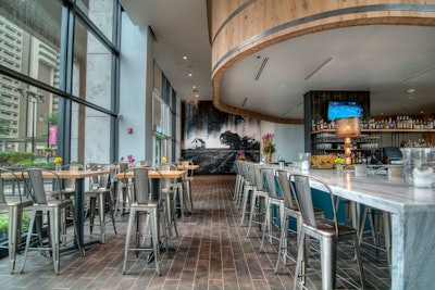 Downtown spot White Oak Kitchen and Cocktails opened in July with Southern cuisine and a distillery-inspired decor. The Distillery dining room, designed to resemble the inside of a whiskey barrel, has burnt cedar plank walls and mahogany beamed ceilings. It seats 80. Two smaller rooms seat 30 each; a reception area holds 100.
