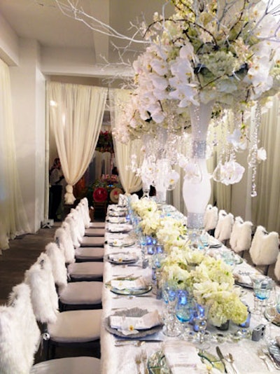 After the ceremonies, the newlyweds and their guests headed to a lunch reception, for which Bailey created three separate tabletop looks. The winter table was covered in a sequined linen and was set with Something Different Party Rental's sparkly Silver Sea Sponge glass chargers and blue Ariana goblets.