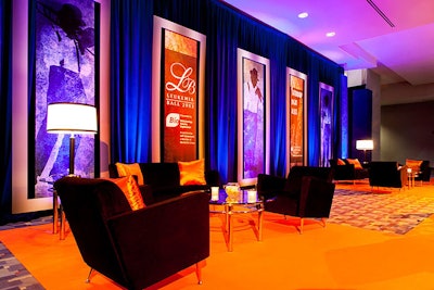 The blue, black, and orange color scheme extended to the lounge areas of the reception space.