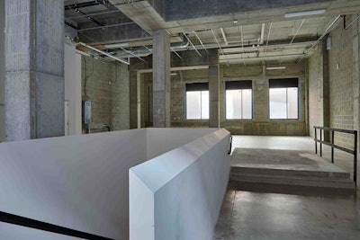 Before the white box, a view of the light-flooded reception