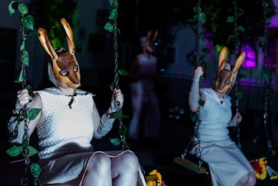 Other surreal, enchanted forest-like vignettes included masked rabbits perched on ivy-covered swings.