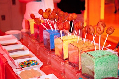 For a fund-raiser in Boston, the Catered Affair set up a doughnut-on-a-stick bar, where guests could top their own treats with colored sugar, candy, and more.