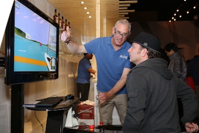 In recognition of Shellback's sponsorship of the Oracle Team USA yacht, which will participate in the America's Cup, the rum hut activation includes a boat-racing simulator.