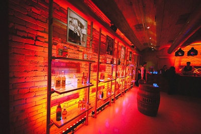 There was, of course, a speakeasy area. It doled out drinks called 'Chappy's Hooch,' named for company C.E.O. Tony Chapman. At the entrance to the space, a hostess held a violin case filled with shots. Inside, LED lights filled whiskey bottles, and beer was served in old gasoline cans.
