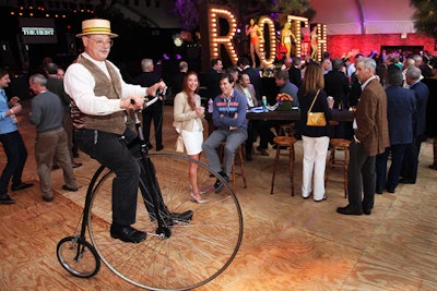 An old-fashioned bicyclist roved in the crowd, adding to the event's eclectic look and feel.