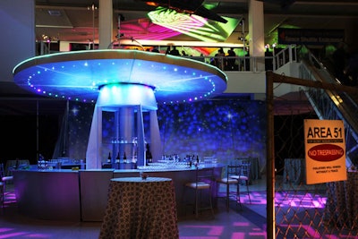 The 'Area 51 lounge' had a giant retro flying saucer as the backdrop for the bar.