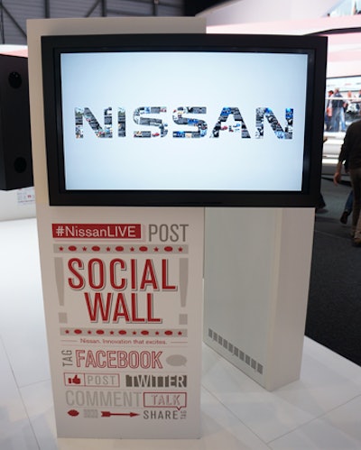 Three social media walls displayed content being shared about Nissan on Facebook and Twitter.