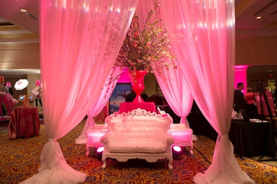 Floor-to-ceiling white draping surrounded the two lounge areas, creating gazebo-like settings.