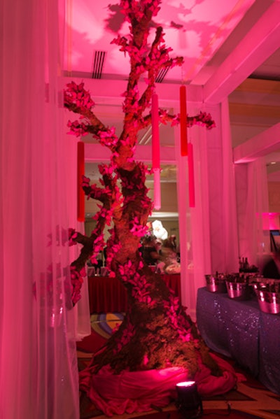 Pink butterflies covered the large wooden tree at the center of the main bar.