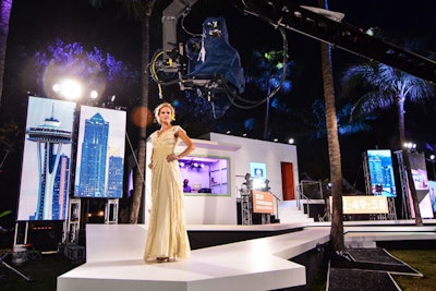 The angular white stage with neon touches spoke to the South Beach location while screens behind the stage referenced landmarks from across the country.