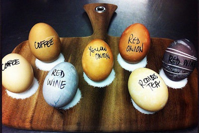 At NoMi Kitchen in Chicago, chefs are prepping for Sunday's festive brunch by dipping eggs into dyes derived from red wine, coffee, tea, and red and yellow onions. The ingredients create softer, more earthy-colored Easter eggs than those made with traditional dyes.