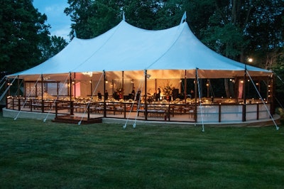 The Spinnaker tent with beautiful peaks and stained wooden poles