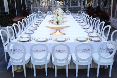 Product launches and press previews for beauty products have historically been dominated by clean, all-white decor, allowing colorful product packaging to take center stage. At a February 21 brunch for L'Oréal, designer and producer Joe Moller added subtle branding to the setup on the Viceroy Miami's outdoor terrace, adding L'Oréal lettering to the backs of chairs and using shallow gold vases filled with products as tabletop centerpieces.