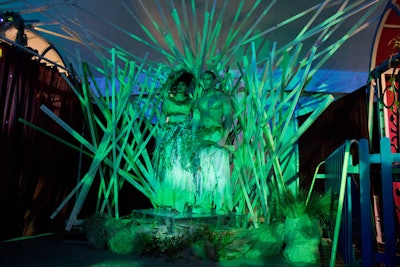 As guests exited the big top after the finale, they were met by two Cirque performers dressed in nature-inspired costumes, standing atop a structure composed of wooden slats.