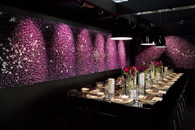At Gensler and Herman Miller's vignette, the dining table was surrounded by walls covered in thousands of Hershey's Kisses wrapped in purple foil. Attendees were invited to take one as a symbol of the 'many hands it takes to spark positive change.'