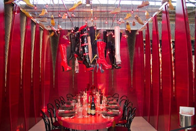 Maya Romanoff and the Rockwell Group collaborated with the producers of Kinky Boots to create a dining environment that would celebrate the April 4 opening of the Broadway show. A chandelier of patent leather boots interspersed with red lightbulbs floated above the red tabletop, and the wall panels were designed to resemble laced-up corsets.