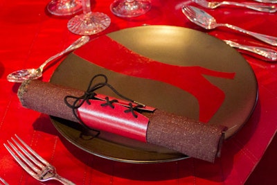 As a nod to the walls at the Kinky Boots table, Romanoff stitched corset-like napkin holders.