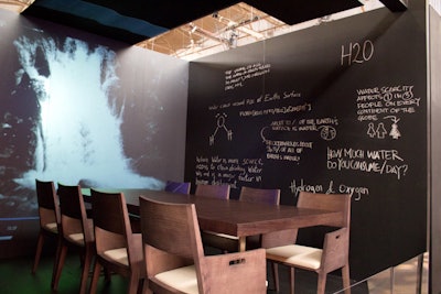 Flexform & Dror's tribute to water conservation included chalkboard walls that had water factoids scrawled across them; at the center was a moving projection of a waterfall.