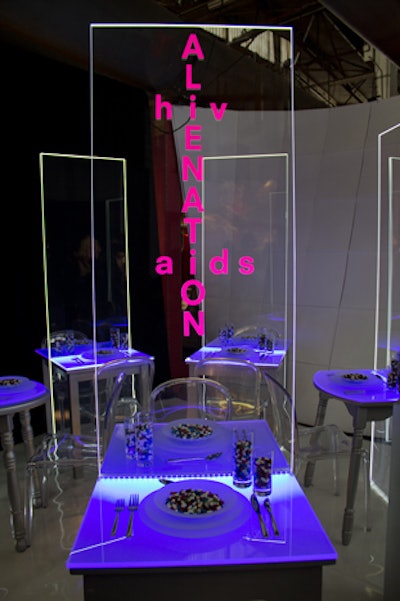Stefan Steilish composed an installation of individual tables separated by Lucite dividers. The idea behind the design was that people diagnosed with HIV/AIDS can feel isolated, but once that person looks beyond, he or she realizes that others are facing the same fears, and connection is possible.