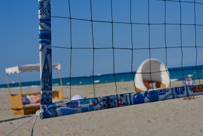 No detail was overlooked—even the perimeter of the volleyball net was wrapped in Hermès silk scarf prints.