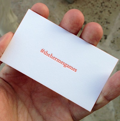 As part of the brand's social media strategy, guests were encouraged to tweet and Instagram their experiences using a special hashtag printed on custom thick cards rimmed in Hermès orange.