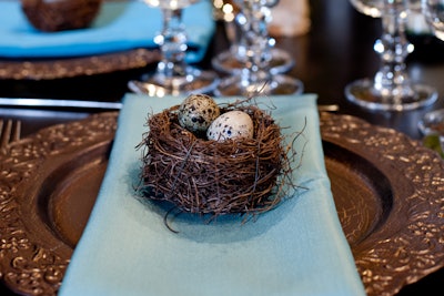 Okay, so they're not Easter decorations per se, but these little nests, accented with Robins egg-blue napkins, are an example of springtime decor that incorporates eggs. Susan Kelly of Three Sisters Flowers and Events in Palo Alto, California, designed this table for a wedding showcase that takes place annually right around Easter.