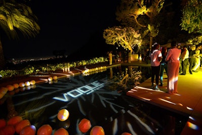 Beach balls filled a pool illuminated with Vogue's logo.
