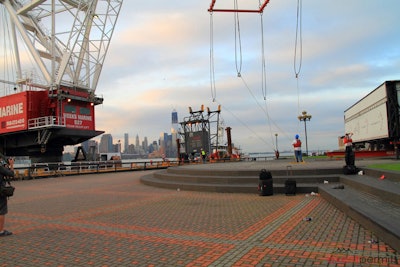 Concert stage arrives on a barge via the Hudson River