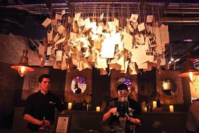 A paper chandelier that hung over a bar featured cocktail recipes that guests could take home, as well as vintage photos of Great Britain and pages from British literature. At the bar beneath, London bartending collective Fluid Movement prepared drinks for guests incorporating Beefeater 24, a new version of the classic gin brand. Two of the collective's concepts, Worship Street Whistling Shop and Purl, performed cocktail-making demonstrations from behind Victorian-style bars.