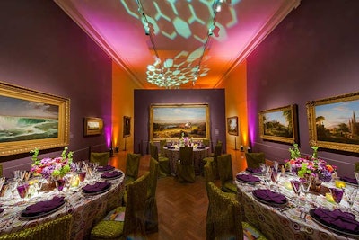Playing off the purple walls of Gallery 2, the tables brought together purple, green, white, and lime-green elements accented by purple uplighting.