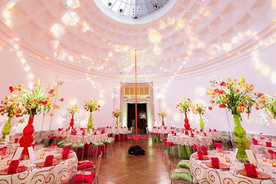 The Rotunda had a Mexican-themed look with white and gold linens accented by tall green, red, and yellow tulip centerpieces on each table.