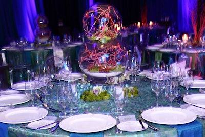 Held on March 9, the Patricia and Phillip Frost Museum of Science’s annual Galaxy Gala had an aquatic theme inspired by the museum’s new facility now under construction, which includes a 500,000-gallon aquarium. Produced by Jose Dans and held at the JW Marriott Marquis, the various centerpiece designs by Wow Factor included stacked fishbowls filled with sand, lichen, pincushion proteas, and red branches.