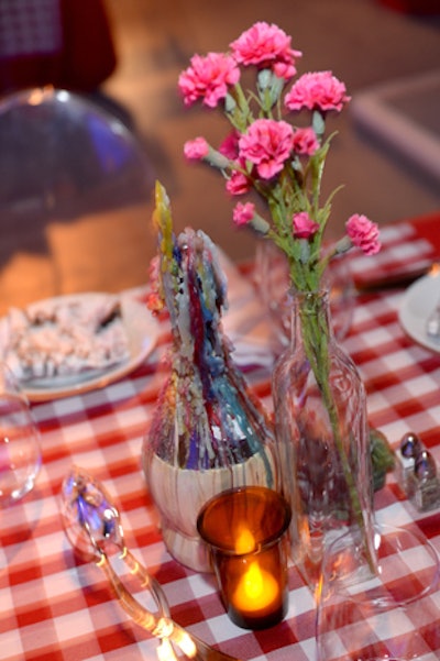 Italian trattoria-style tables covered in red-and-white checked tablecloths had Chianti bottle drip candles.