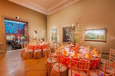 Gallery 5 has numerous landscapes lining the walls that lent the space to a springtime theme. Though pink is commonly used in such cases, the team chose to go a different direction with peach and coral linens and chairs.