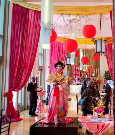 The ballroom's foyer featured hanging cherry blossoms, red lanterns, and pink drapes. A costumed geisha greeted guests and posed for pictures.