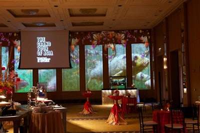 Ballroom walls displayed moving projections of a colorful koi pond.