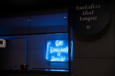 One of the interactive stations was called 'Tantalize that Tongue,' and a neon sign encouraged guests to 'Get Yourself a Snack.'