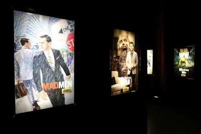 After checking in, guests walked from the draped entry foyer into a mini maze of zigzag corridors meant to serve as a mental palate cleanser. A gallery of AMC programming images and show posters hung against black drapes, illuminated by light boxes standing around each corner.