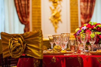 Gold rosette chair covers matched the napkins on each place setting.