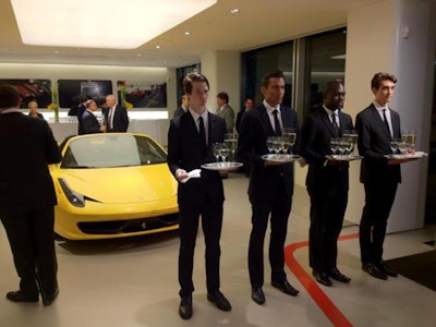 Handsome staff complement the exotic cars at a Ferrari Event