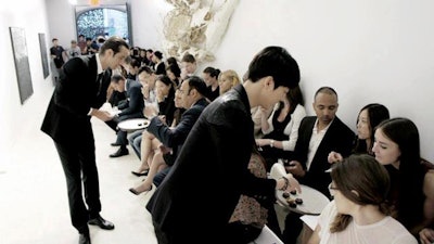 Staff distribute h'orderves to guests at BESFREN Fashion Show