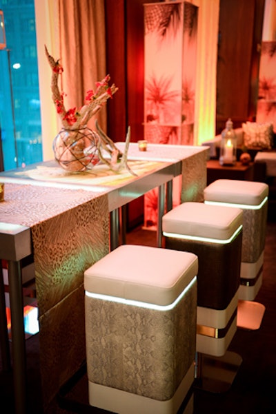 Lounge22 Odyssey Glo Barstools mixed with Square Bar Tables offered a nice change to conventional cocktail tables and seating. 'Using the illuminated tabletops with static cling images, graphics, or logos, the tables are functional, stylish, and also provided soft light to the space,' said Dwayne Ridgaway of Perfect Surroundings.