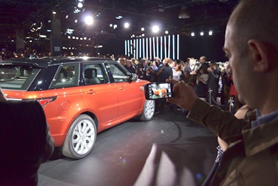Following Daniel Craig's exit, the 700 invited guests were invited to have a closer look at the new Range Rover Sport, which was parked on a rotating stage elevated six inches off the ground. The entire venue was dressed in black carpeting, while vertical light tubes provided an element of urban design.