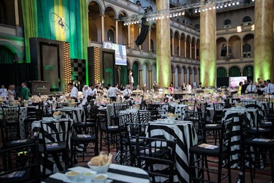 The black and white decor extended off the stage to highboys draped in striped linens with black chairs. The tables provided seating for general admission ticket holders who did not purchase V.I.P. dinner seats.