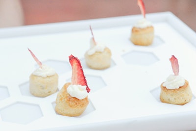 Pinch Food Design provided the bevy of light and sweet bites for the party. All desserts, passed on simple white trays, followed a pink, red, or white color palette, including a strawberry shortcake served atop a lemon scone (pictured).