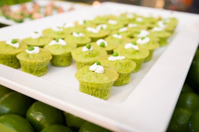 At the green appetizer cart, a sleek white tray held miniature pea souflées.
